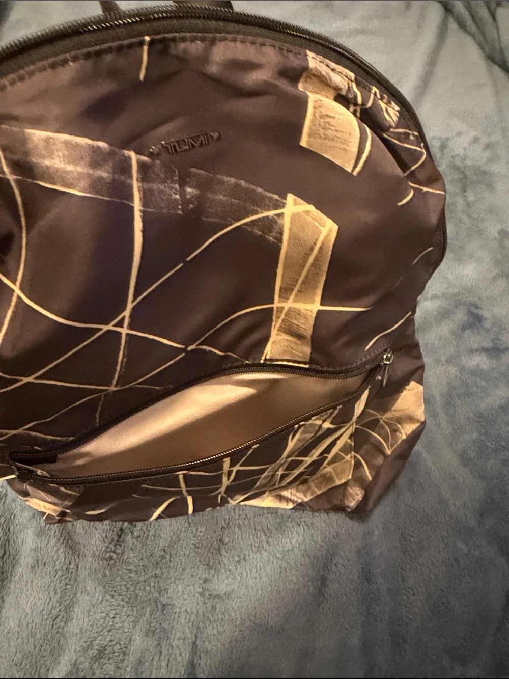 Tumi Black Backpack with Beige Abstract Brushstroke Print